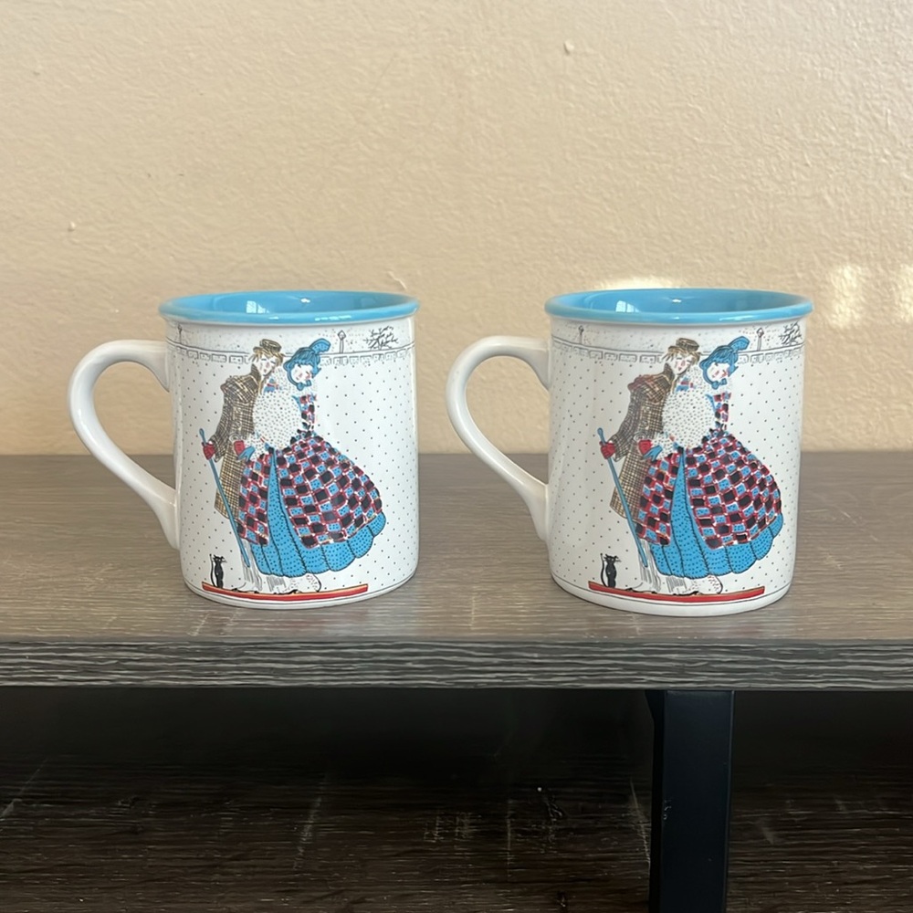 Vintage mugs of happy couple and black cat